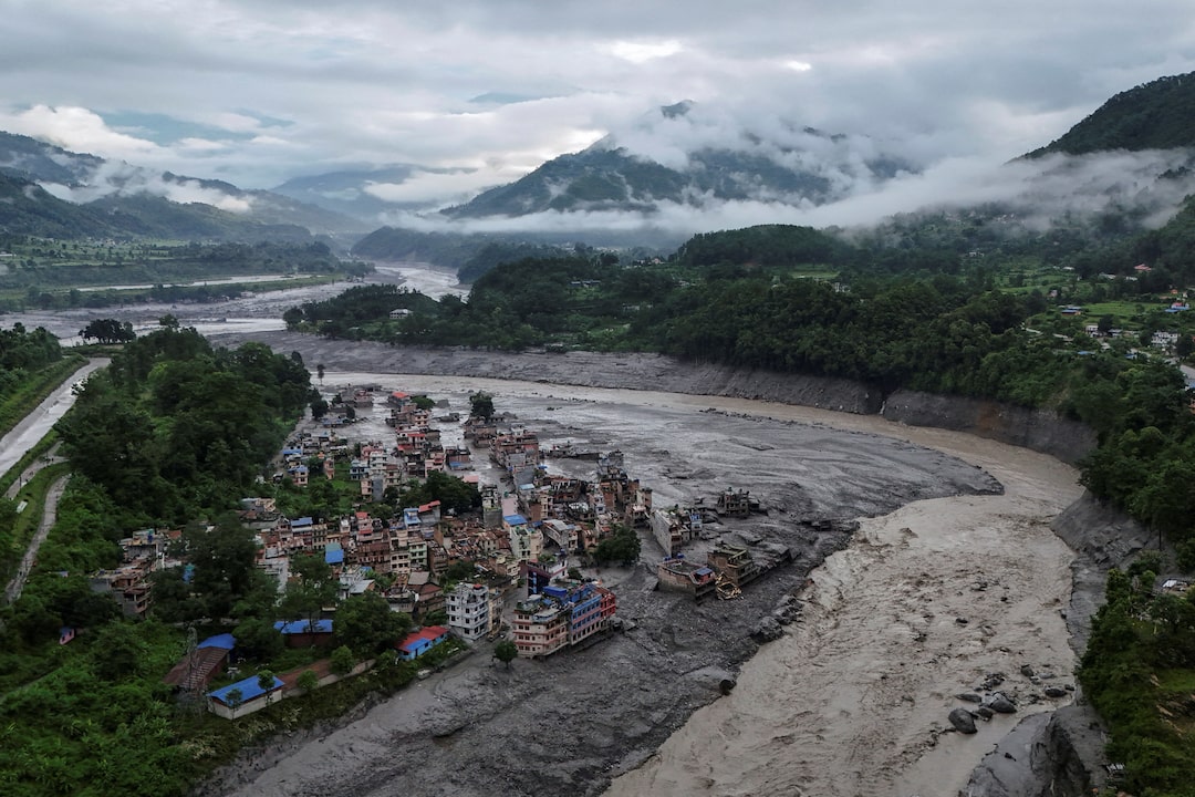 Aerial view of flooding and damaged buildings in a Himalayan valley in Nepal